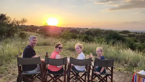 Family enjoying a sundowner on safari with Goggi Africa Safari