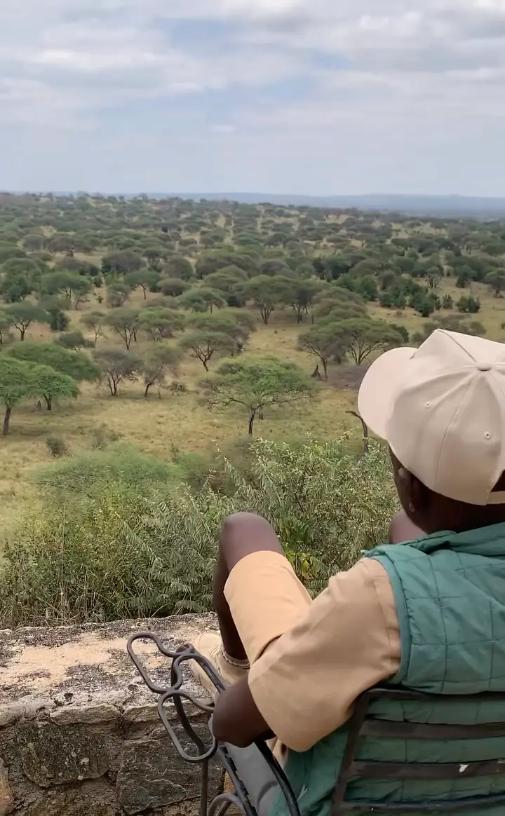 Goggi guide looking out over the Tarangire River valley
