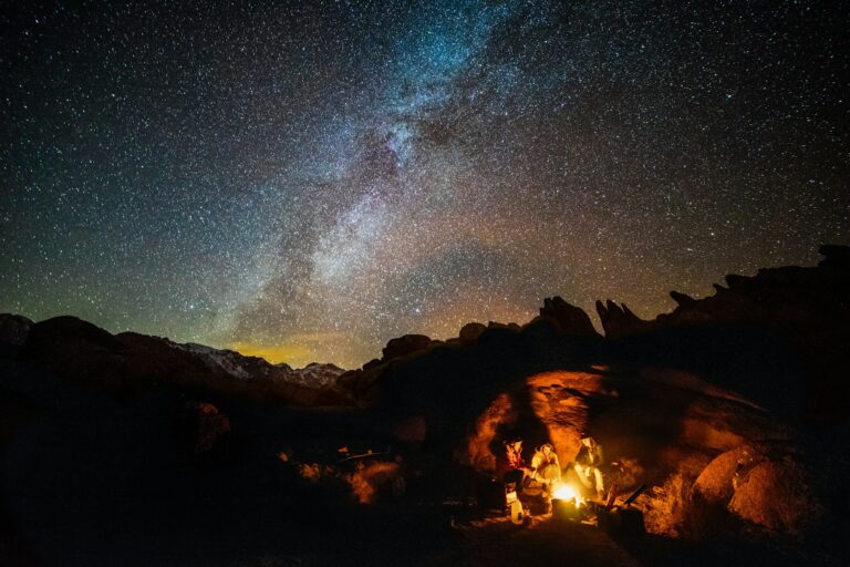 Campfire under a starry night sky