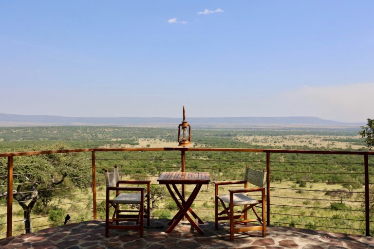 Lodge deck with table and chairs overlooking the plains