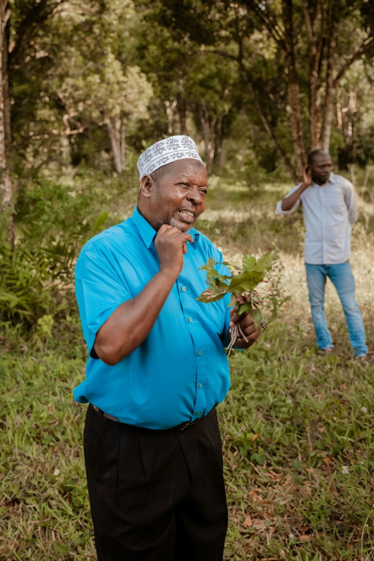 Holding a spice plant on a farm tour